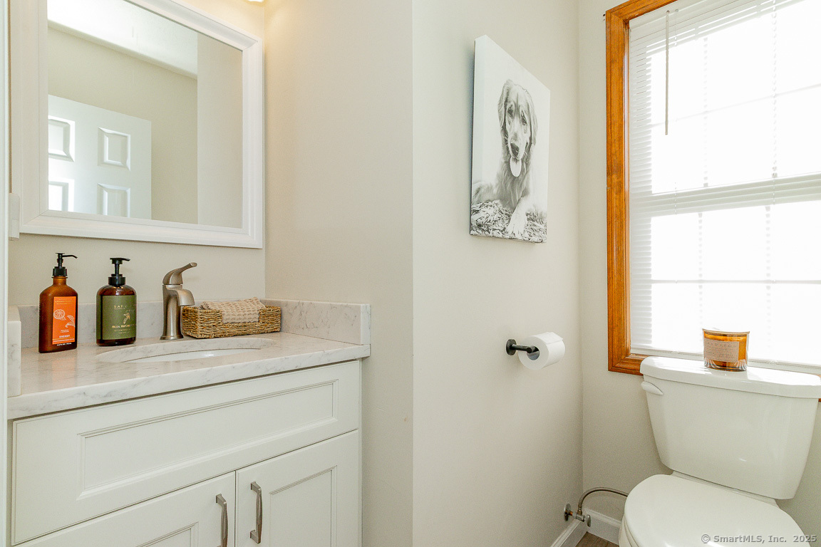 27 Deer Run Trail Manchester, CT 06042 - Photo 13 of 40 a bathroom with a toilet a sink and a window
