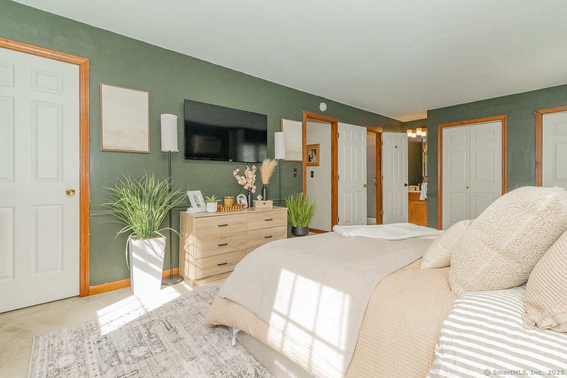 27 Deer Run Trail Manchester, CT 06042 - Photo 19 of 40 a bedroom with a large bed and a window