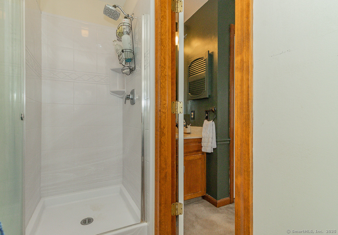 27 Deer Run Trail Manchester, CT 06042 - Photo 22 of 40 a bathroom with a glass shower door