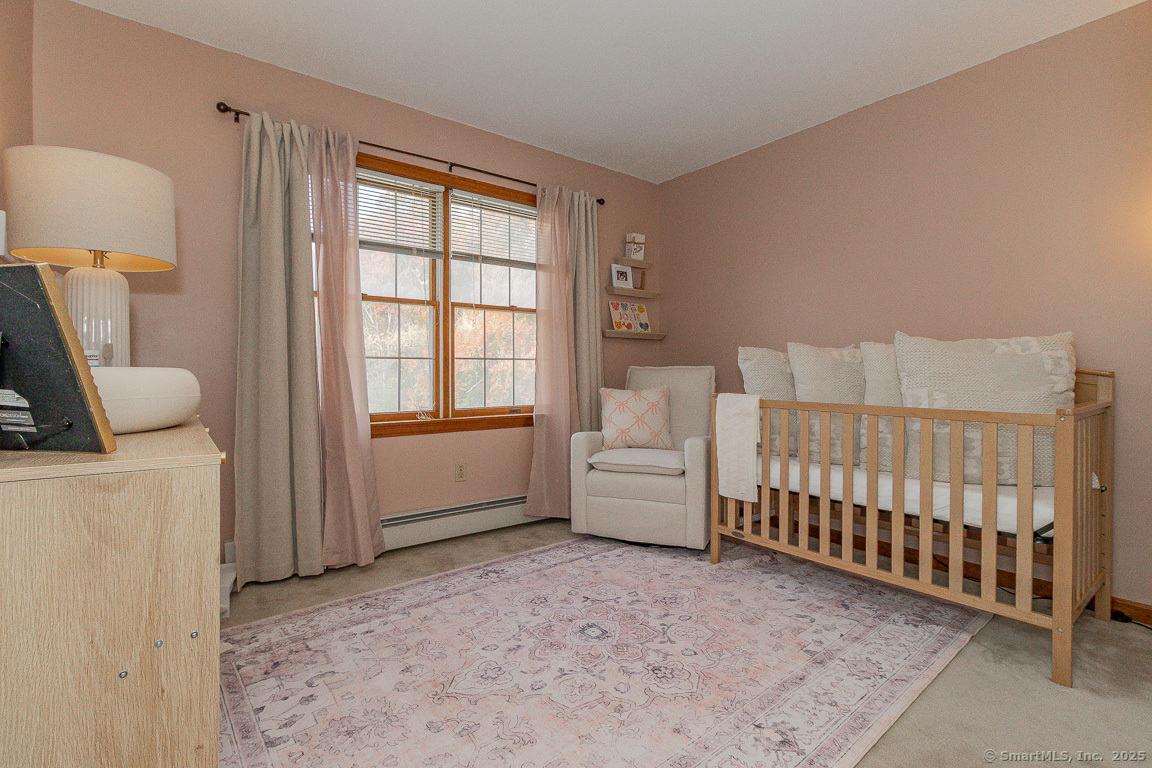 27 Deer Run Trail Manchester, CT 06042 - Photo 23 of 40 a view of a bedroom with furniture and windows