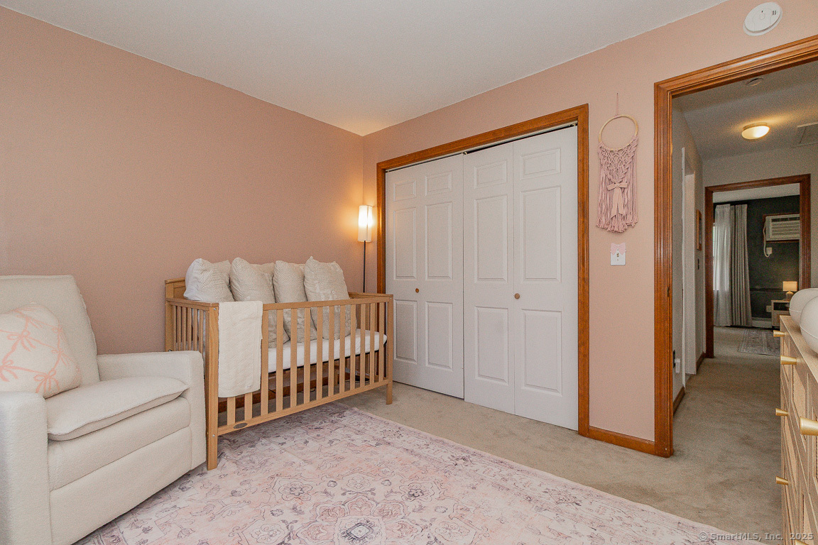 27 Deer Run Trail Manchester, CT 06042 - Photo 24 of 40 a bedroom with furniture and wooden floor
