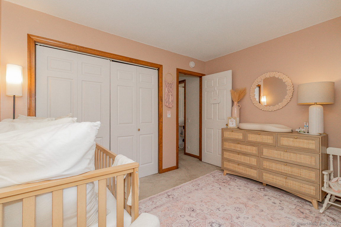 27 Deer Run Trail Manchester, CT 06042 - Photo 25 of 40 a bedroom with a bed and cabinets