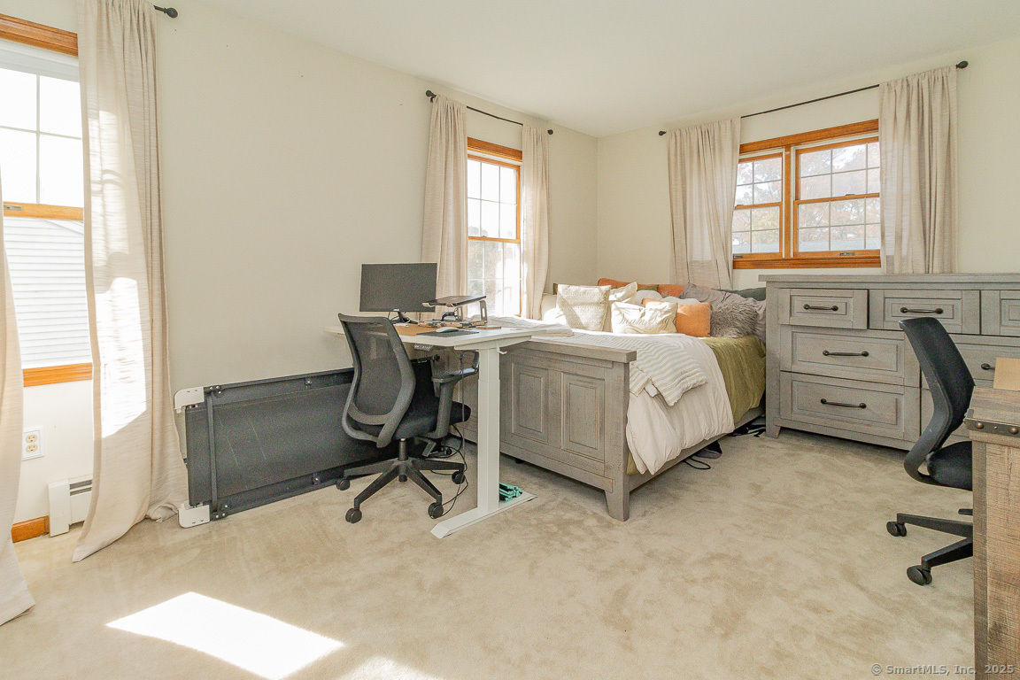 27 Deer Run Trail Manchester, CT 06042 - Photo 27 of 40 a bedroom with a bed and a desk