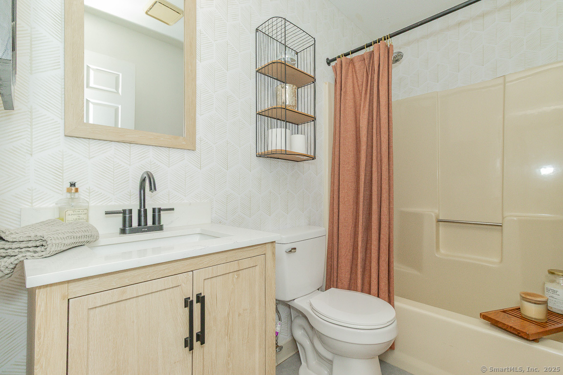 27 Deer Run Trail Manchester, CT 06042 - Photo 29 of 40 a bathroom with a sink a toilet and shower