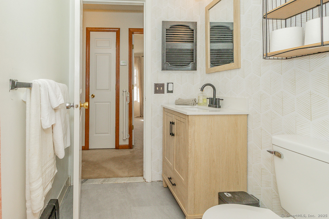 27 Deer Run Trail Manchester, CT 06042 - Photo 30 of 40 a bathroom with a sink and a mirror