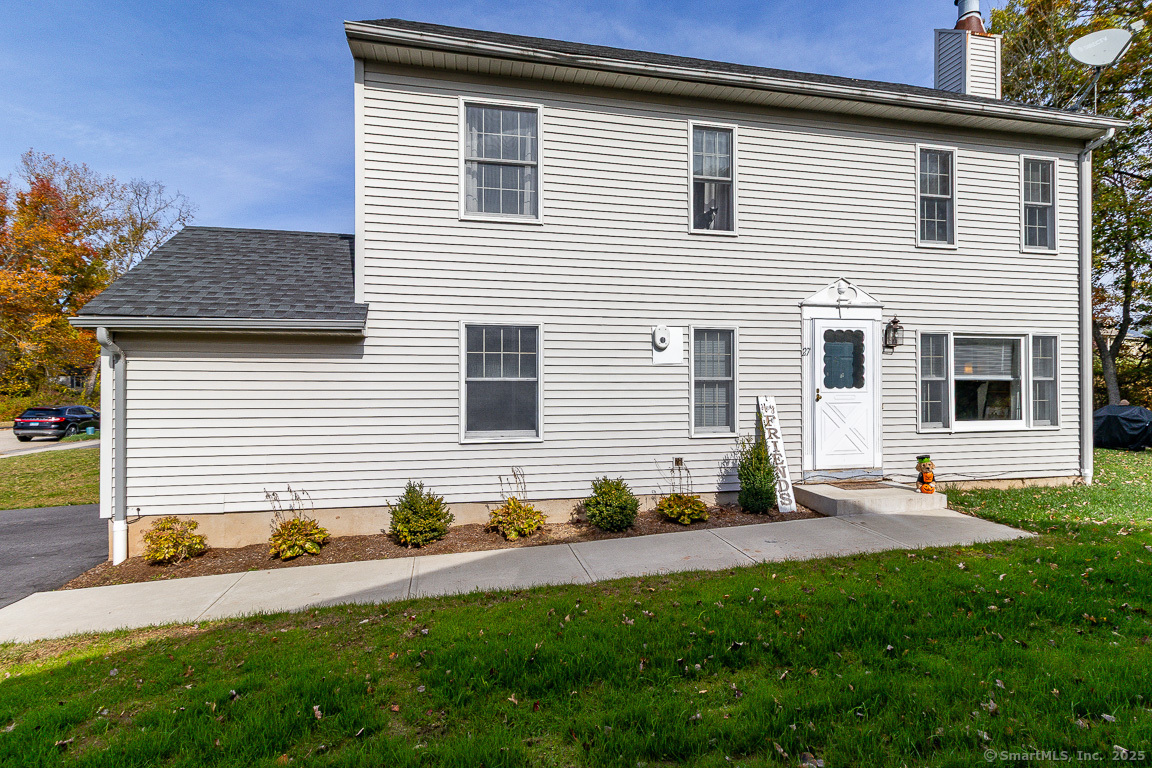 27 Deer Run Trail Manchester, CT 06042 - Photo 35 of 40 a front view of a house with a garden and plants