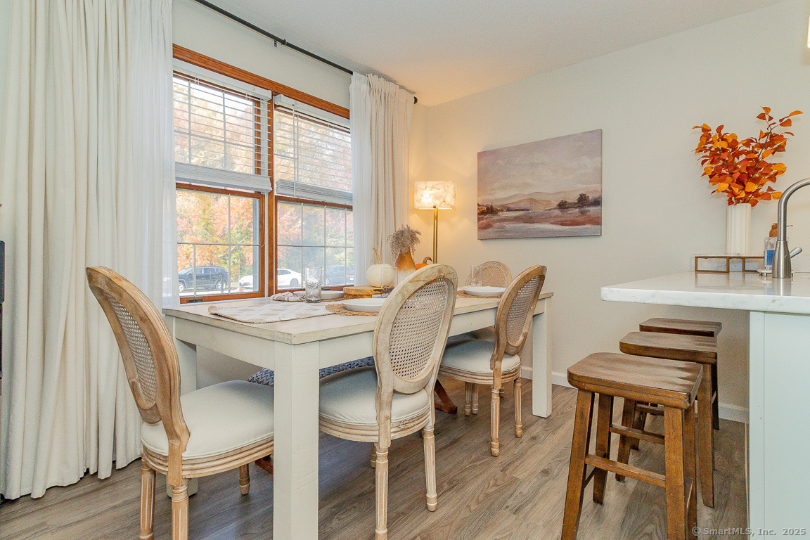 27 Deer Run Trail Manchester, CT 06042 - Photo 7 of 40 a view of a dining room with furniture window and wooden floor