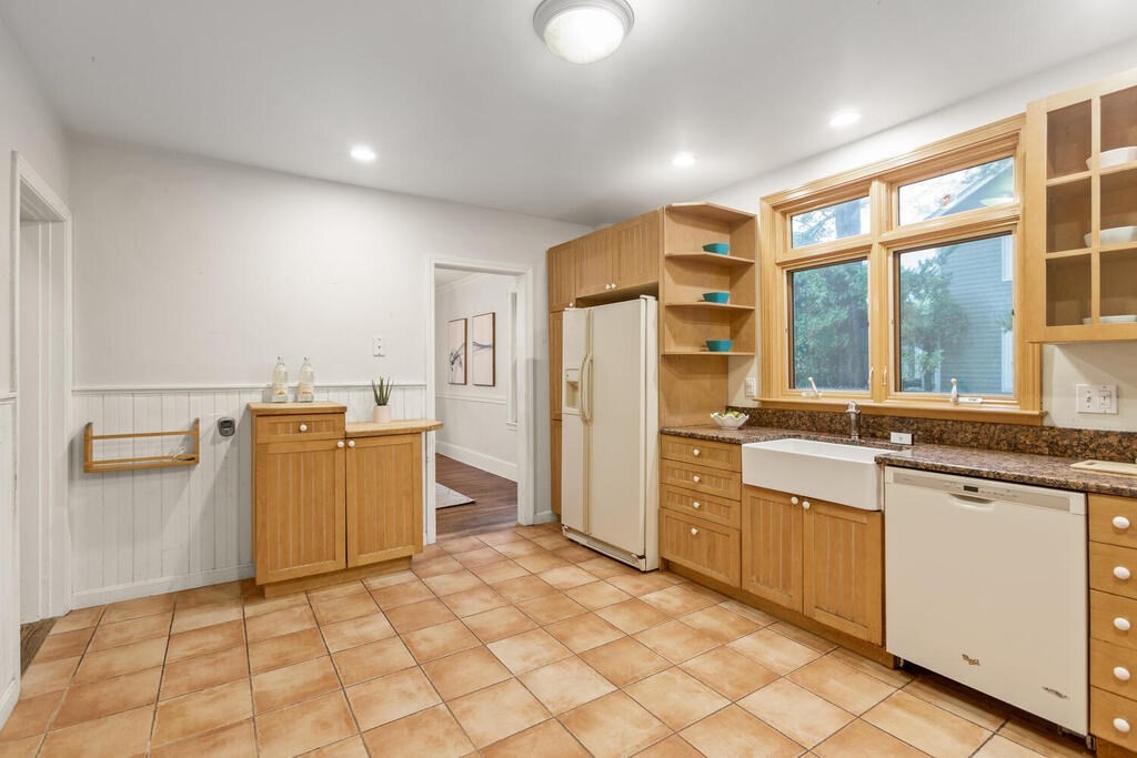 67 Coolidge Road Arlington, MA 02476 - Photo 13 of 34 a kitchen with a refrigerator and a sink