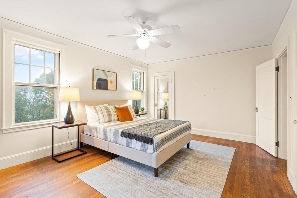 67 Coolidge Road Arlington, MA 02476 - Photo 17 of 34 a room with a bed and a large window