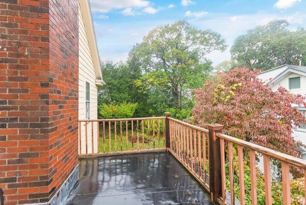 67 Coolidge Road Arlington, MA 02476 - Photo 19 of 34 a view of balcony with wooden floor