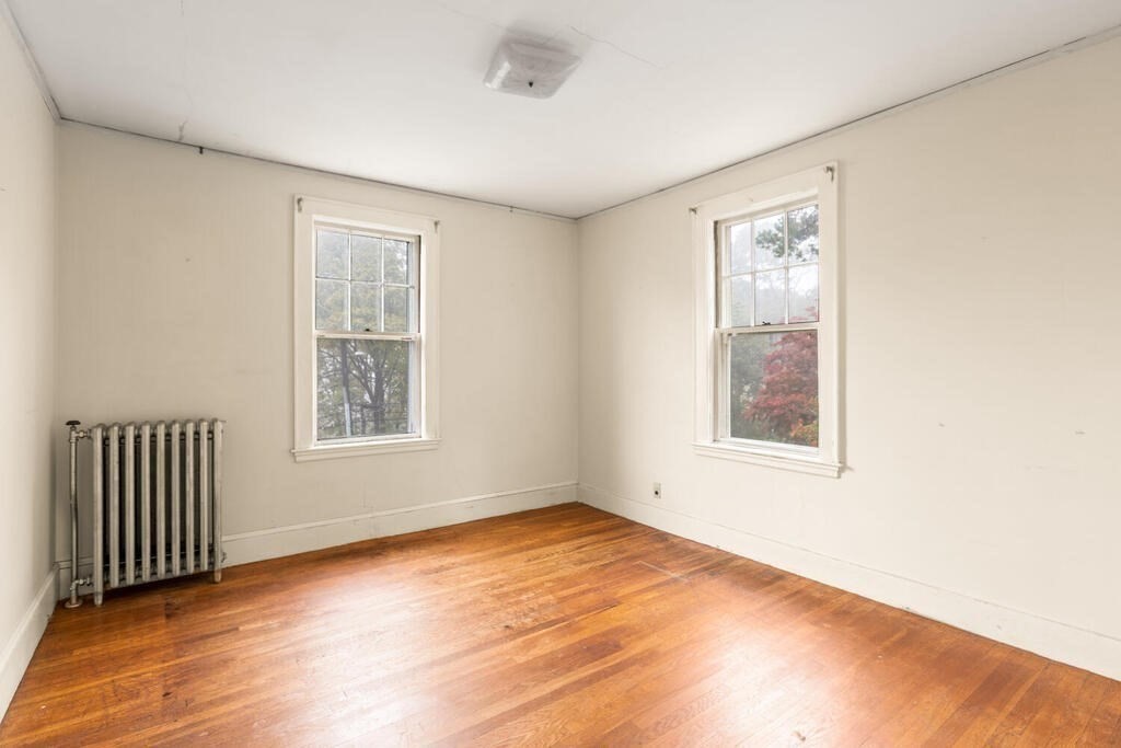67 Coolidge Road Arlington, MA 02476 - Photo 20 of 34 an empty room with windows