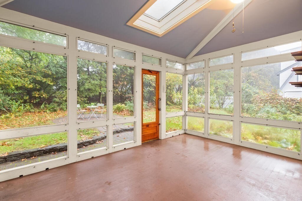 67 Coolidge Road Arlington, MA 02476 - Photo 25 of 34 a view of an empty room with wooden floor and a window