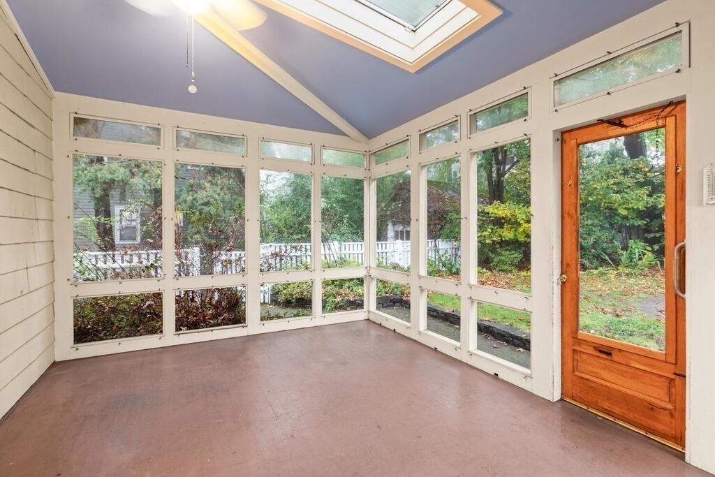 67 Coolidge Road Arlington, MA 02476 - Photo 26 of 34 a view of a building with a garden