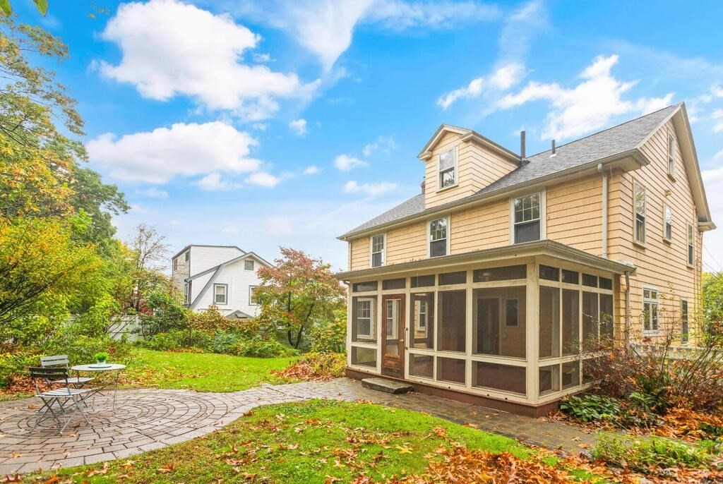 67 Coolidge Road Arlington, MA 02476 - Photo 27 of 34 a front view of a house with a yard