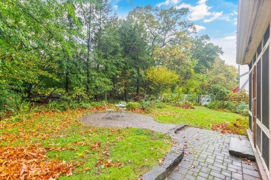 67 Coolidge Road Arlington, MA 02476 - Photo 29 of 34 a view of a yard with plants and large trees