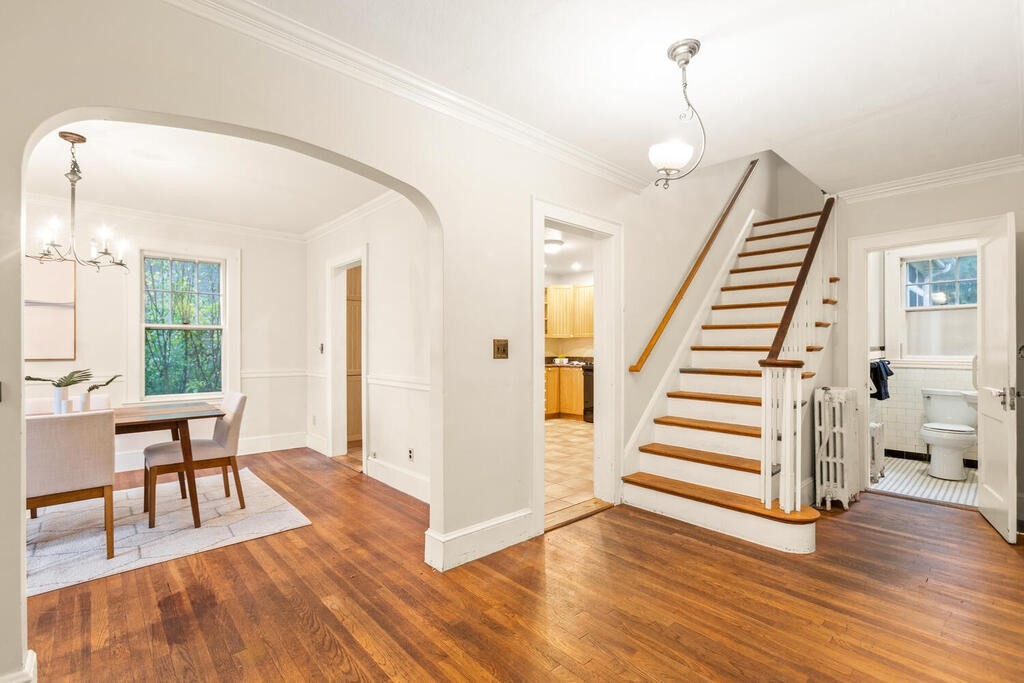 67 Coolidge Road Arlington, MA 02476 - Photo 4 of 34 a view of a room with wooden floor and stairs