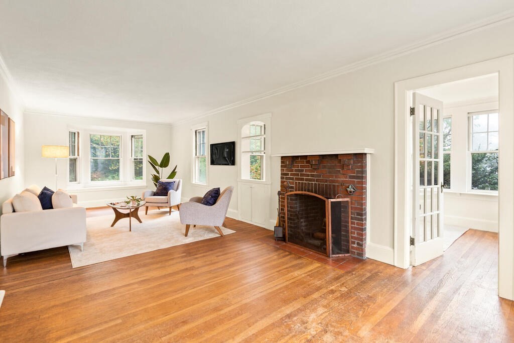 67 Coolidge Road Arlington, MA 02476 - Photo 5 of 34 a living room with furniture and a fireplace