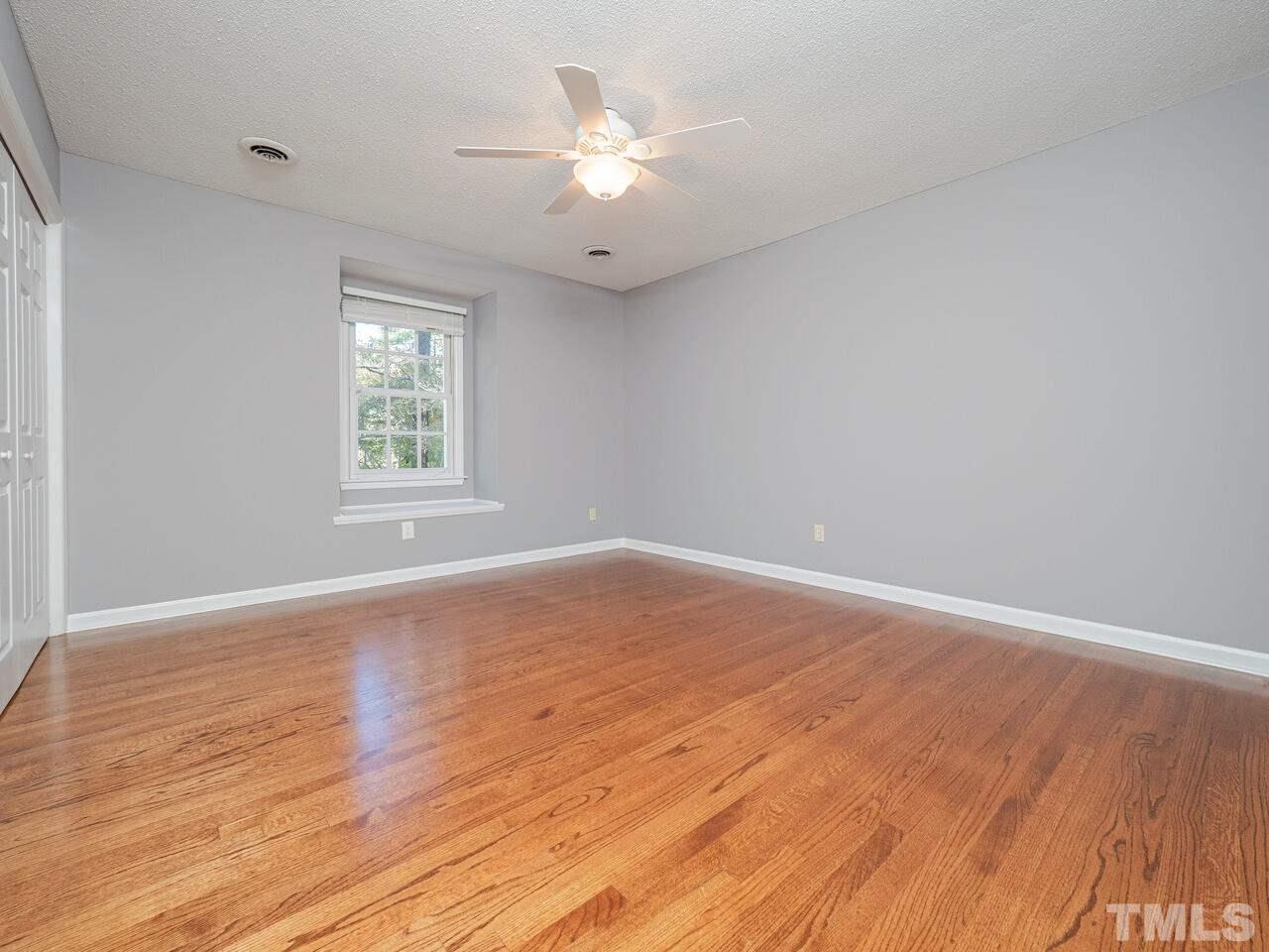 4604 Fernham Place Raleigh, NC 27612 - Photo 25 of 30 an empty room with wooden floor and windows