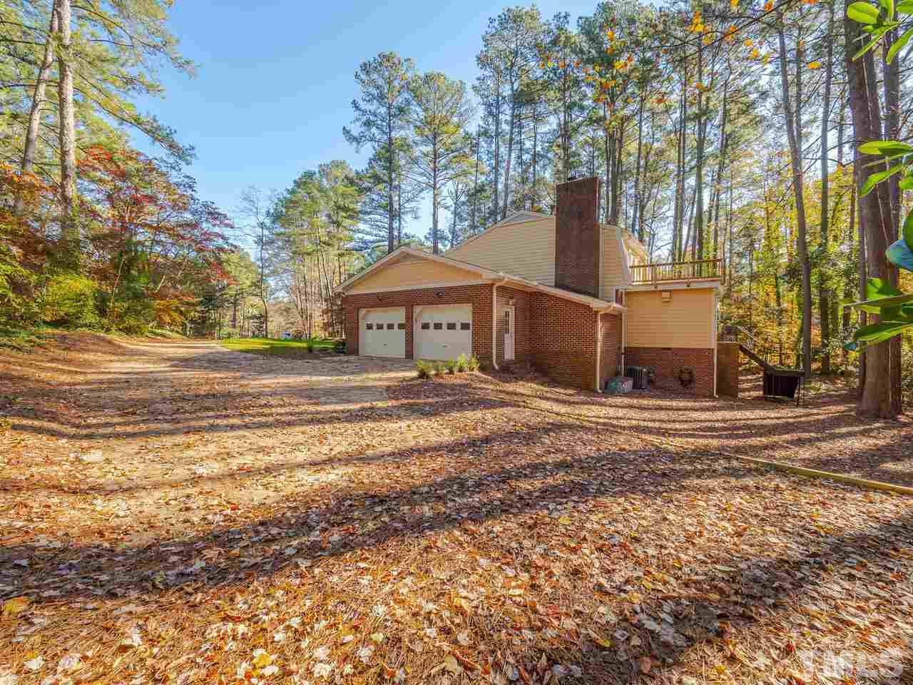 4604 Fernham Place Raleigh, NC 27612 - Photo 30 of 30 a view of a house with a yard and tree s