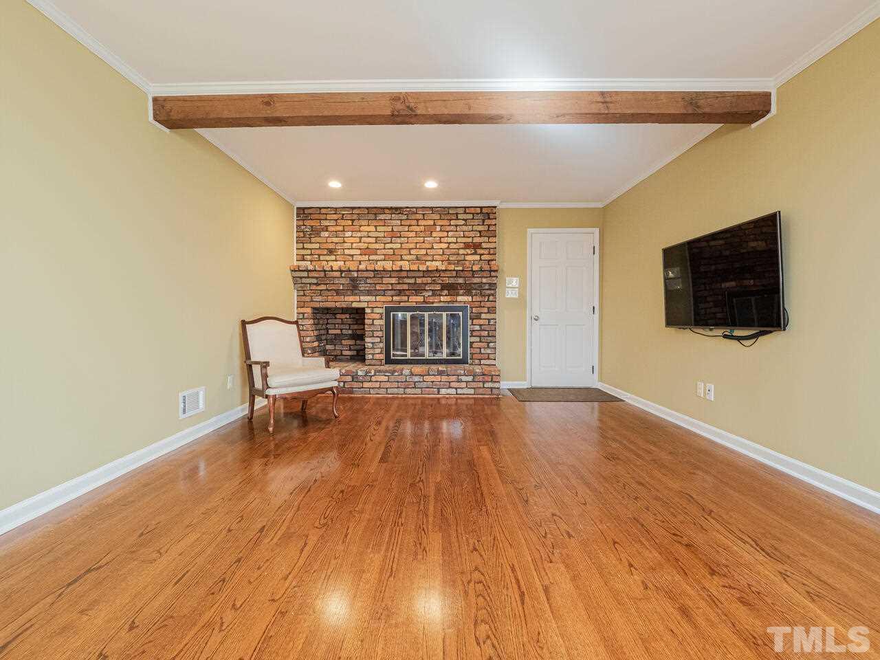 4604 Fernham Place Raleigh, NC 27612 - Photo 10 of 30 a view of a livingroom with a flat screen tv