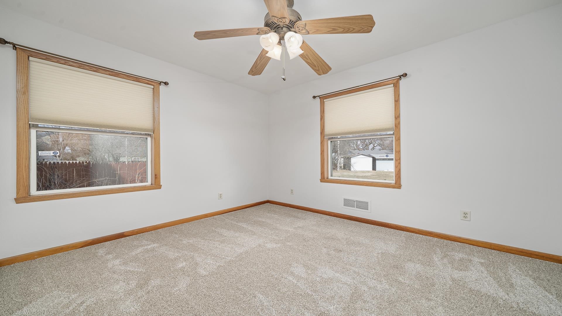 2005 East Ridge Road Beloit, WI 53511 - Photo 17 of 34 an empty room with windows and fan