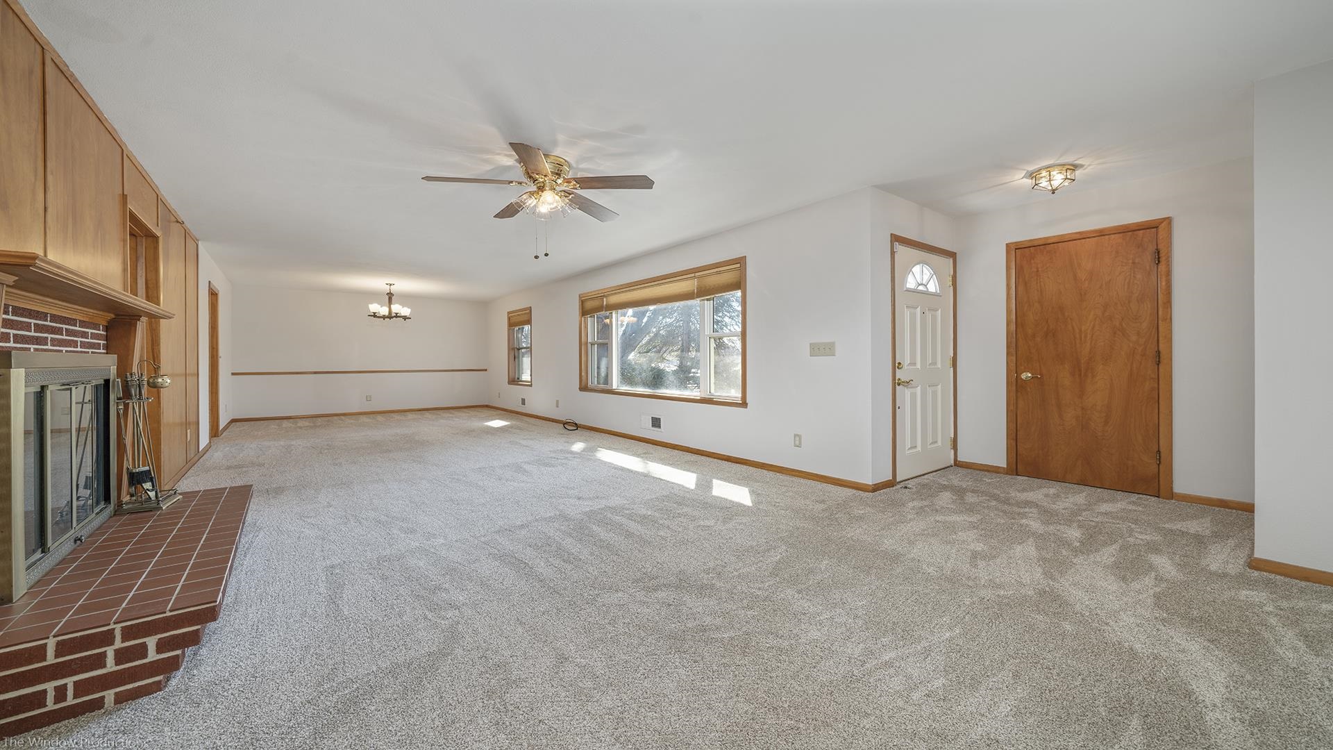 2005 East Ridge Road Beloit, WI 53511 - Photo 4 of 34 an empty room with windows and ceiling fan