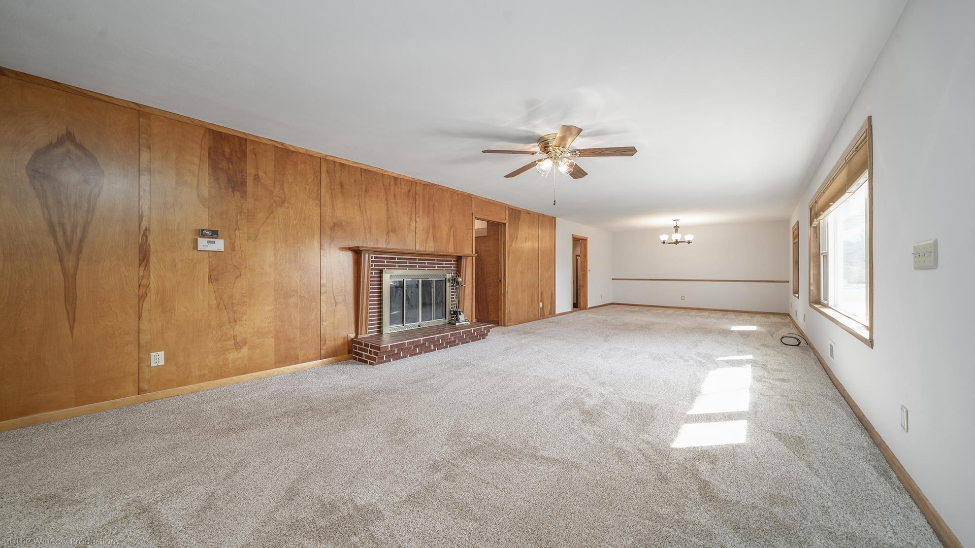 2005 East Ridge Road Beloit, WI 53511 - Photo 5 of 34 a view of empty room with fireplace and fan