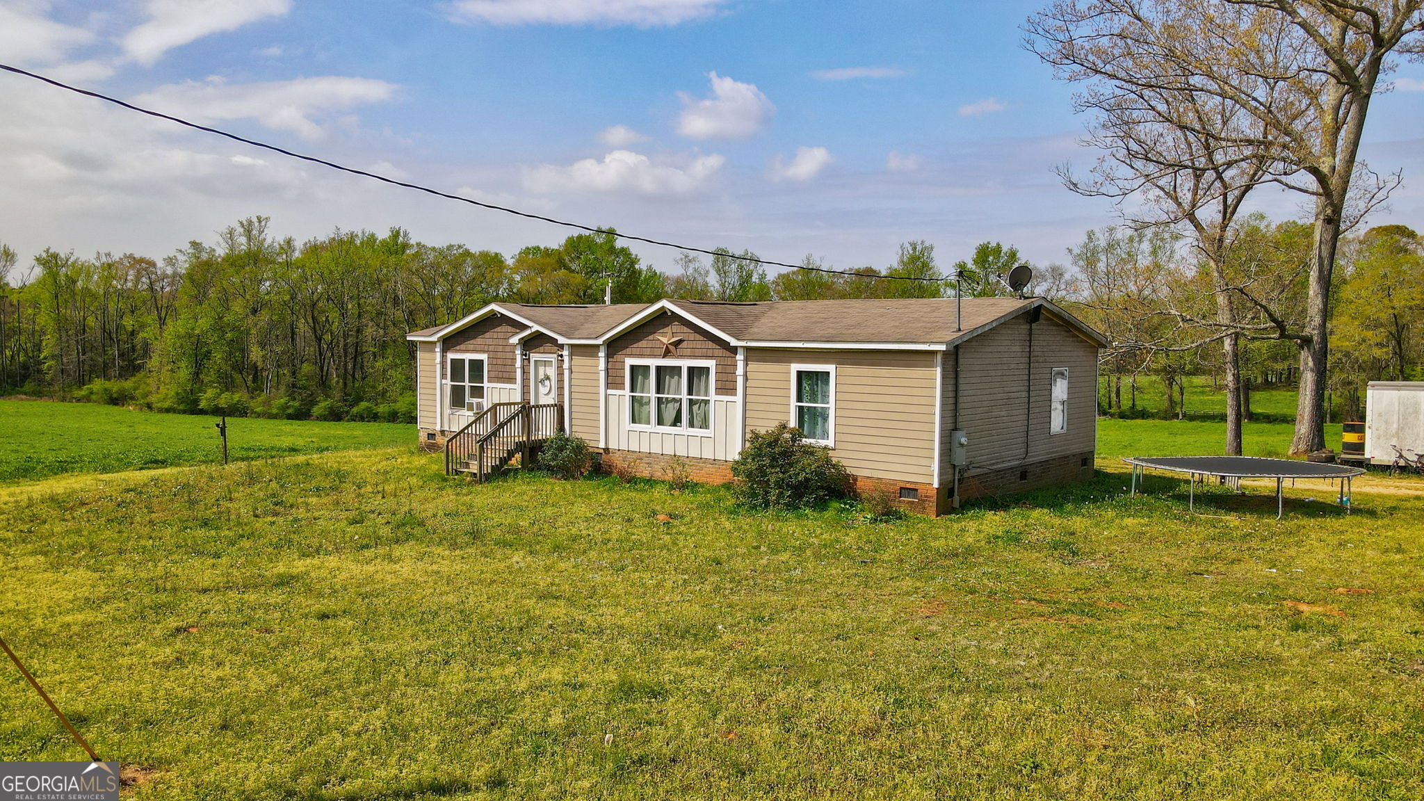 1291 Apalachee River Road Madison, GA 30650 - Photo 12 of 84 a view of a house with a yard