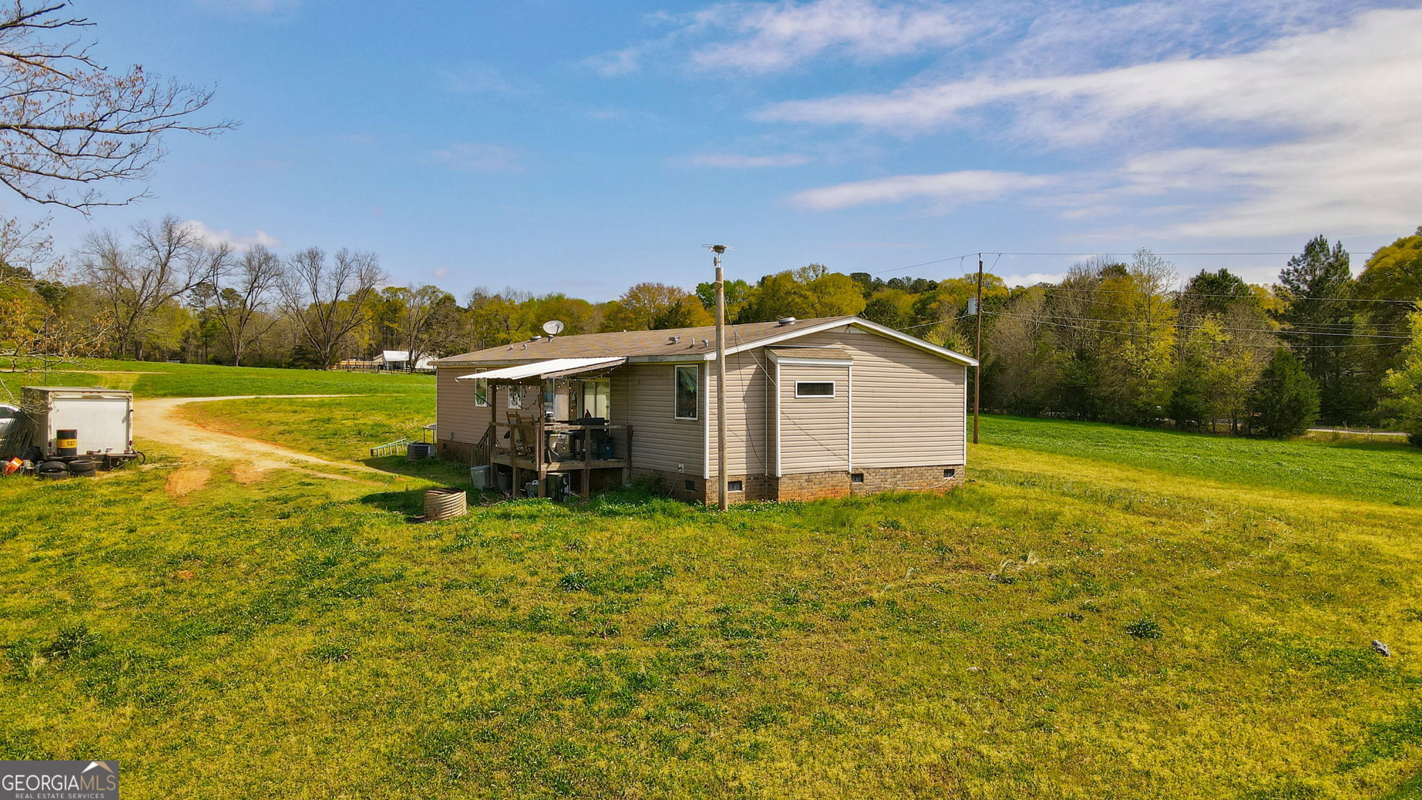 1291 Apalachee River Road Madison, GA 30650 - Photo 15 of 84 a view of a house with a yard