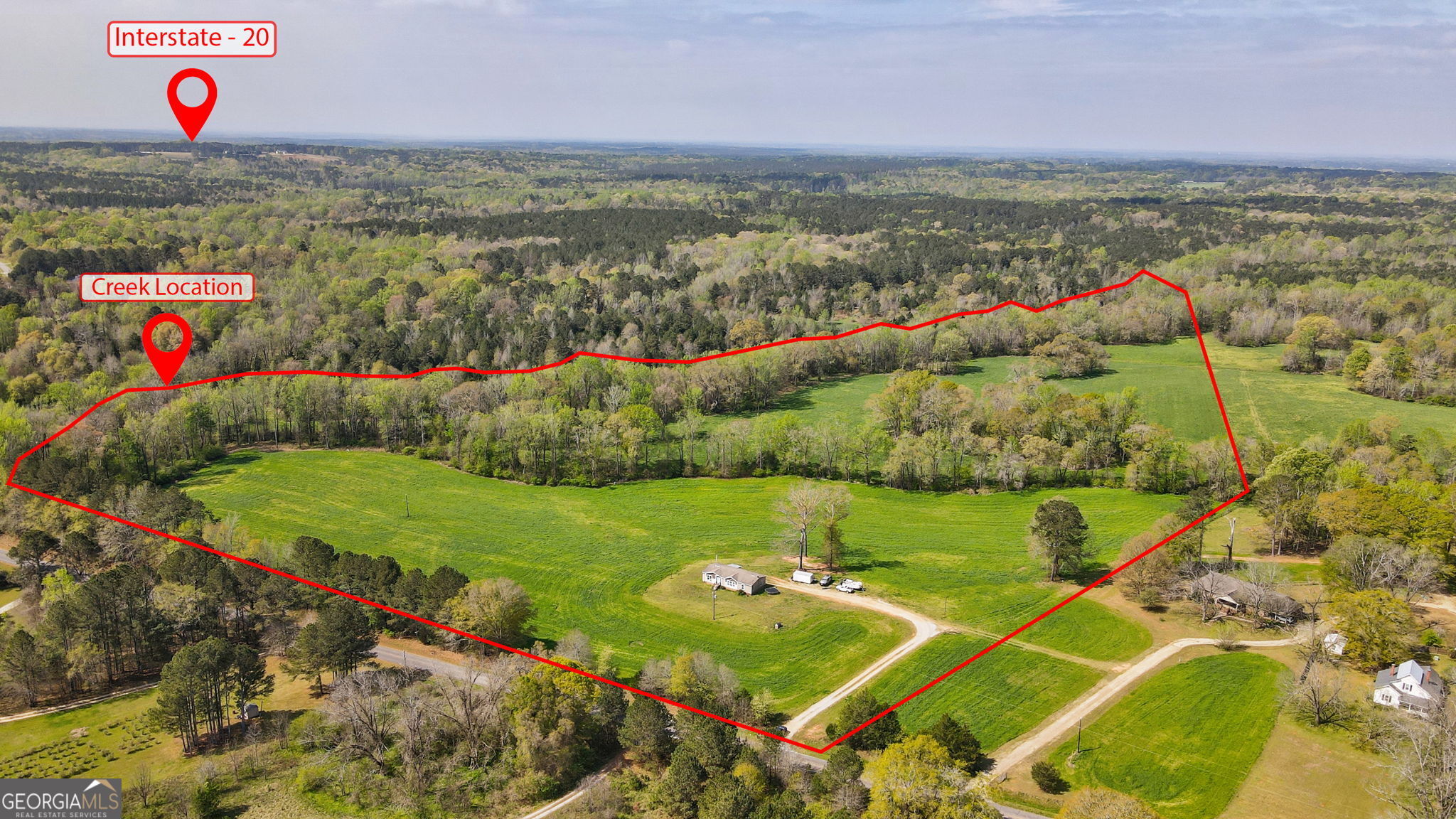 1291 Apalachee River Road Madison, GA 30650 - Photo 2 of 84 a view of a field with an outdoor space