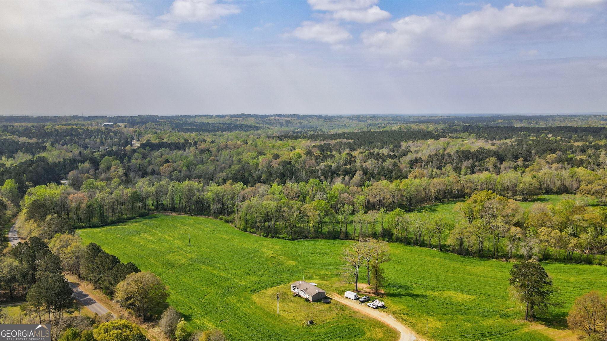 1291 Apalachee River Road Madison, GA 30650 - Photo 27 of 84 a view of a city with green field