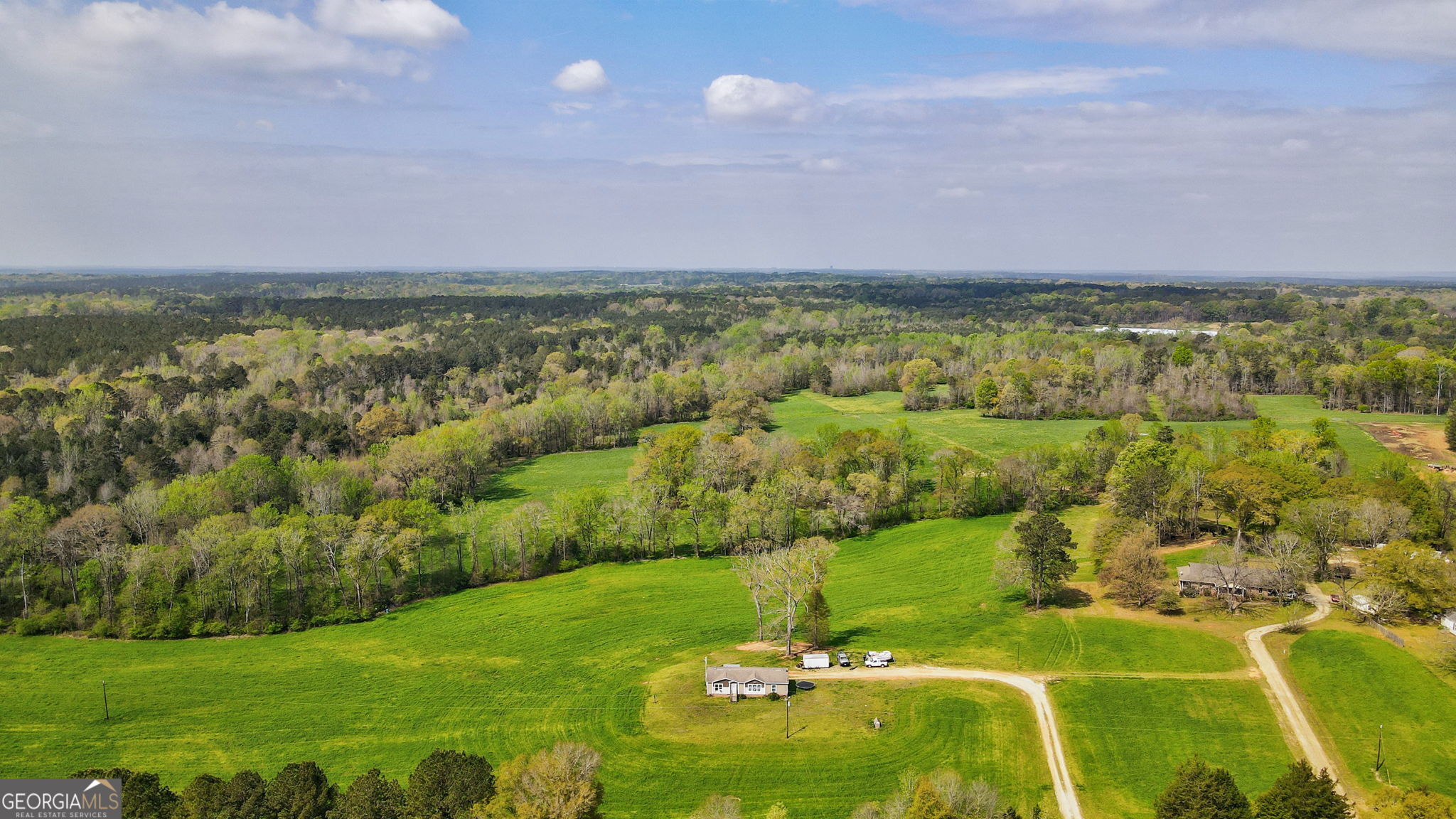 1291 Apalachee River Road Madison, GA 30650 - Photo 28 of 84 a view of a lake with a city