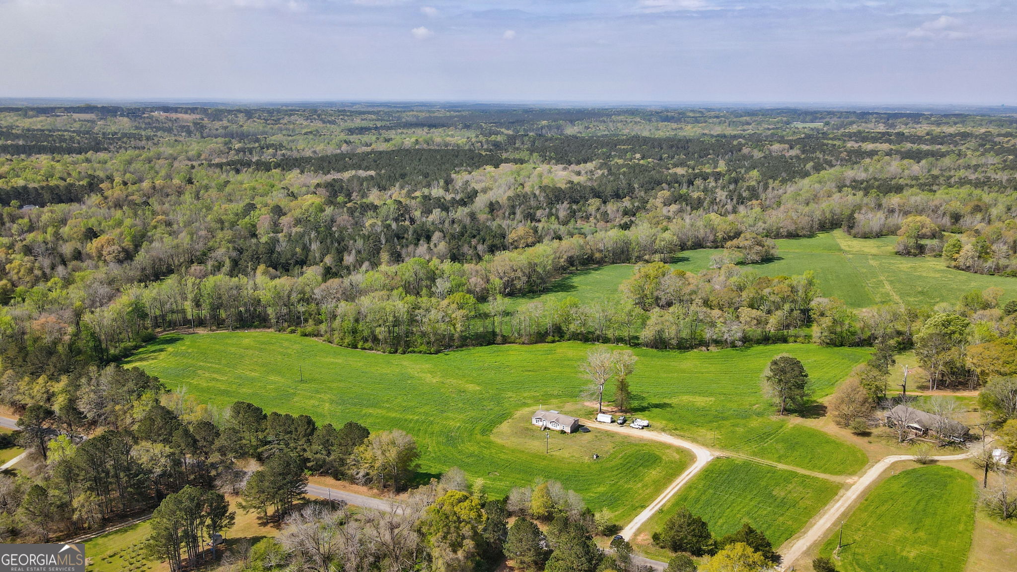 1291 Apalachee River Road Madison, GA 30650 - Photo 3 of 84 a view of a field with an ocean