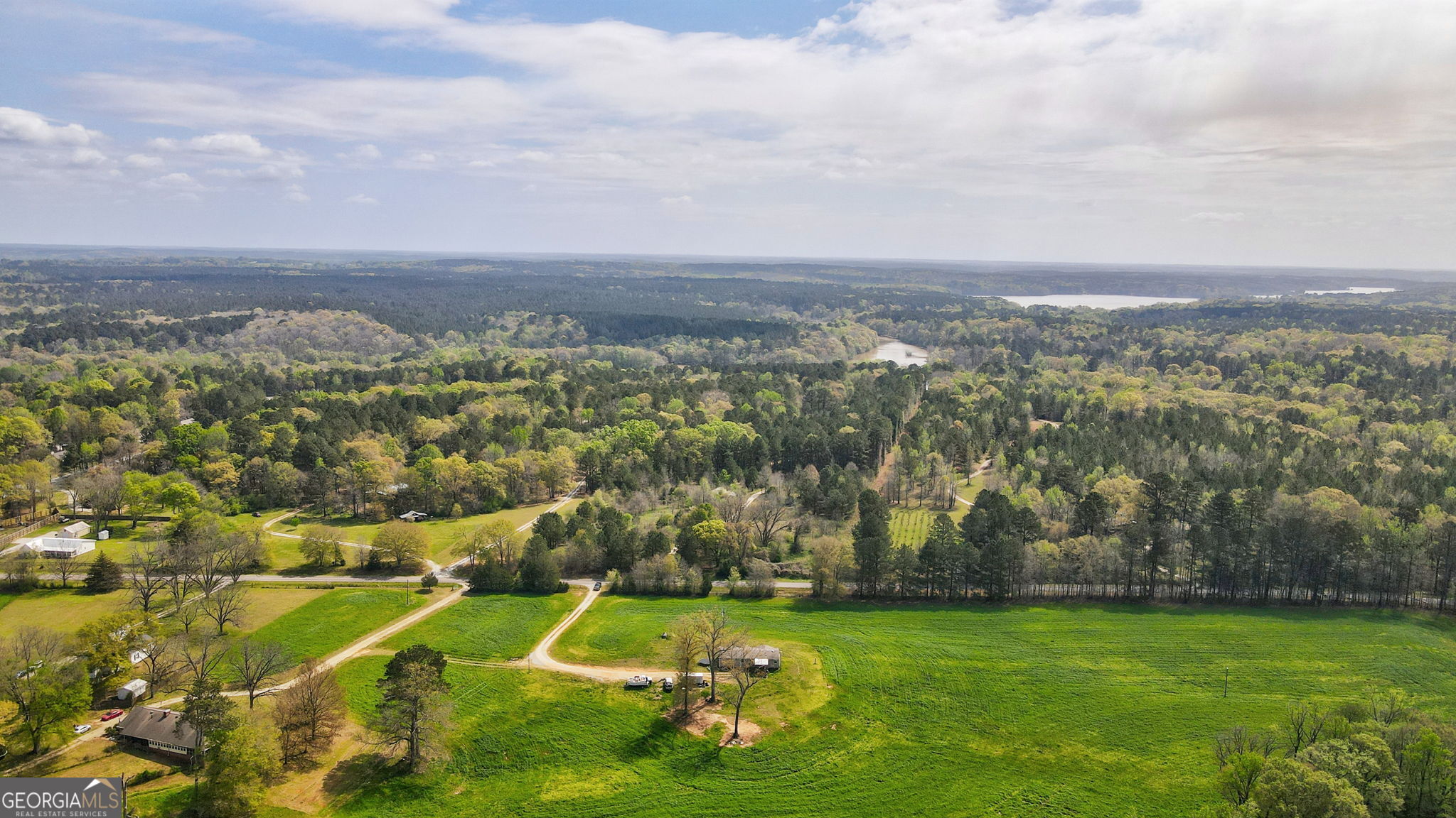 1291 Apalachee River Road Madison, GA 30650 - Photo 32 of 84 an aerial view of residential houses with outdoor space