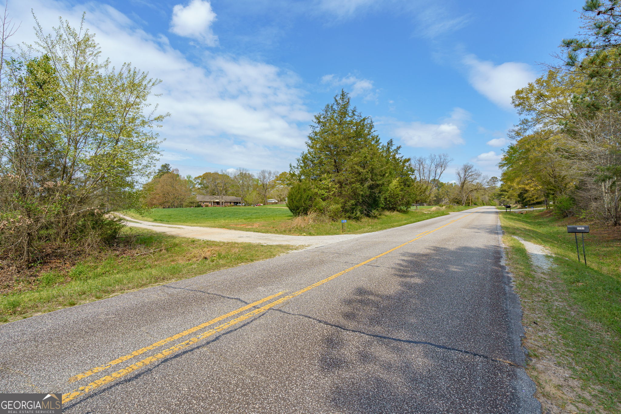 1291 Apalachee River Road Madison, GA 30650 - Photo 83 of 84 a view of a yard and basketball court