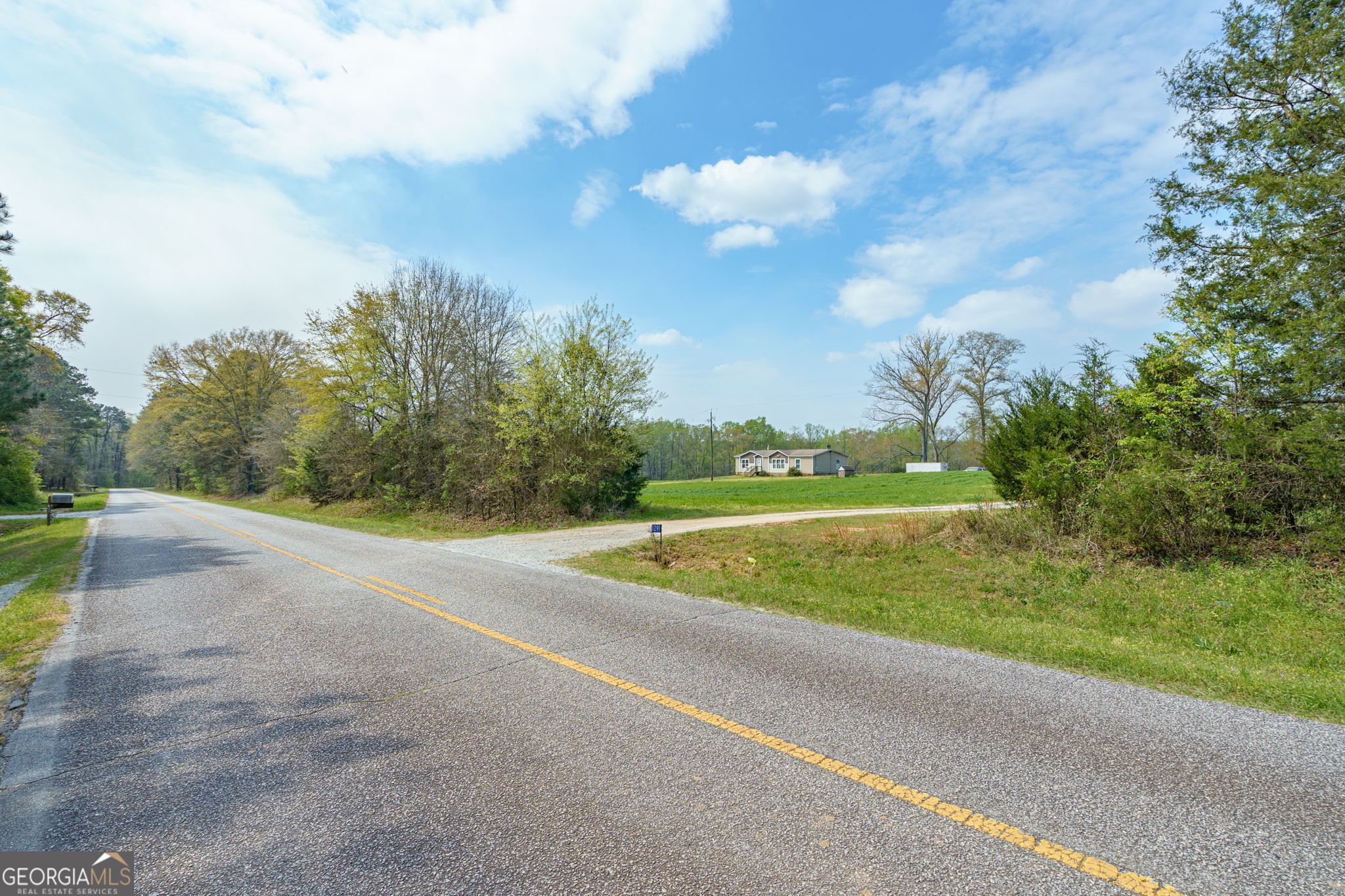 1291 Apalachee River Road Madison, GA 30650 - Photo 84 of 84 a view of a golf course with a lake