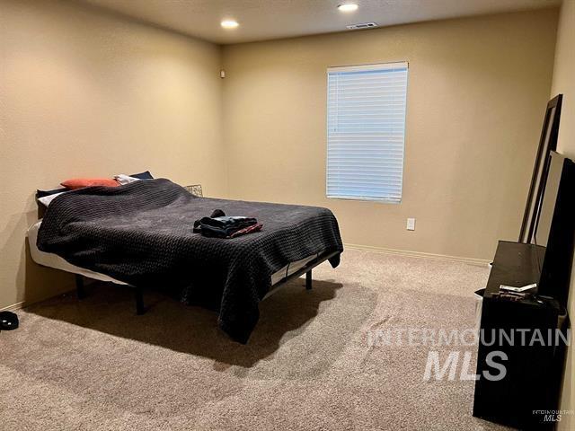 6498 South Lighthouse Place Boise, ID 83709 - Photo 12 of 16 Bedroom with light carpet and recessed lighting