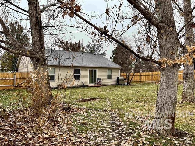 6498 South Lighthouse Place Boise, ID 83709 - Photo 16 of 16 Rear view of house featuring a fenced backyard and a patio area