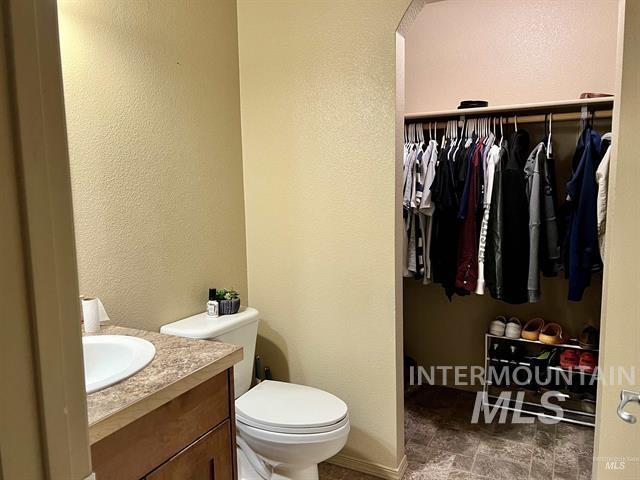6498 South Lighthouse Place Boise, ID 83709 - Photo 8 of 16 Bathroom featuring vanity and a textured wall