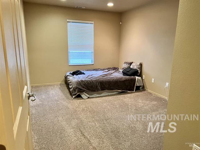 6498 South Lighthouse Place Boise, ID 83709 - Photo 9 of 16 Bedroom with carpet flooring and baseboards