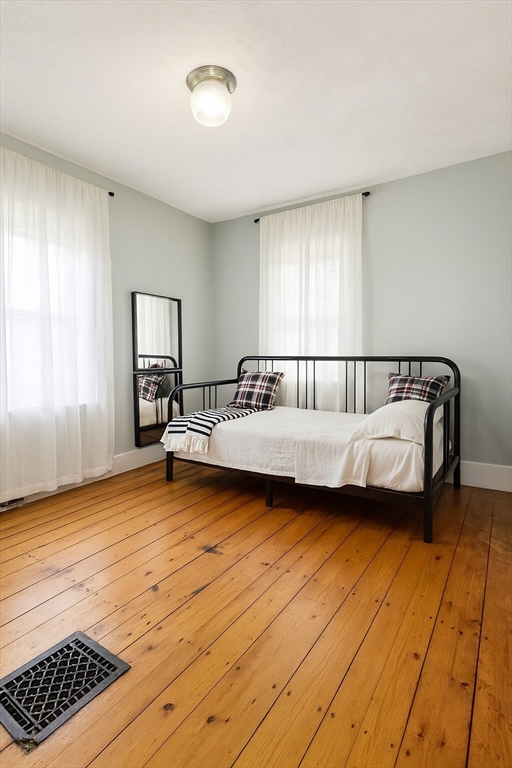 74 Davison Street Boston, MA 02136 - Photo 11 of 20 a bedroom with a bed and window