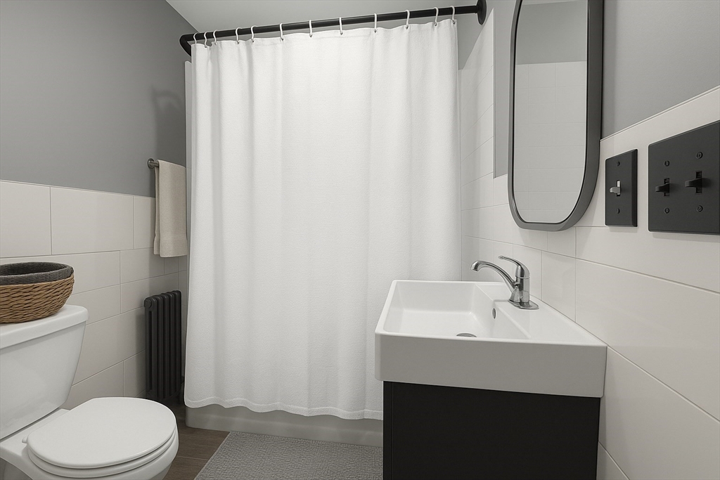 74 Davison Street Boston, MA 02136 - Photo 15 of 20 a bathroom with a sink toilet and shower
