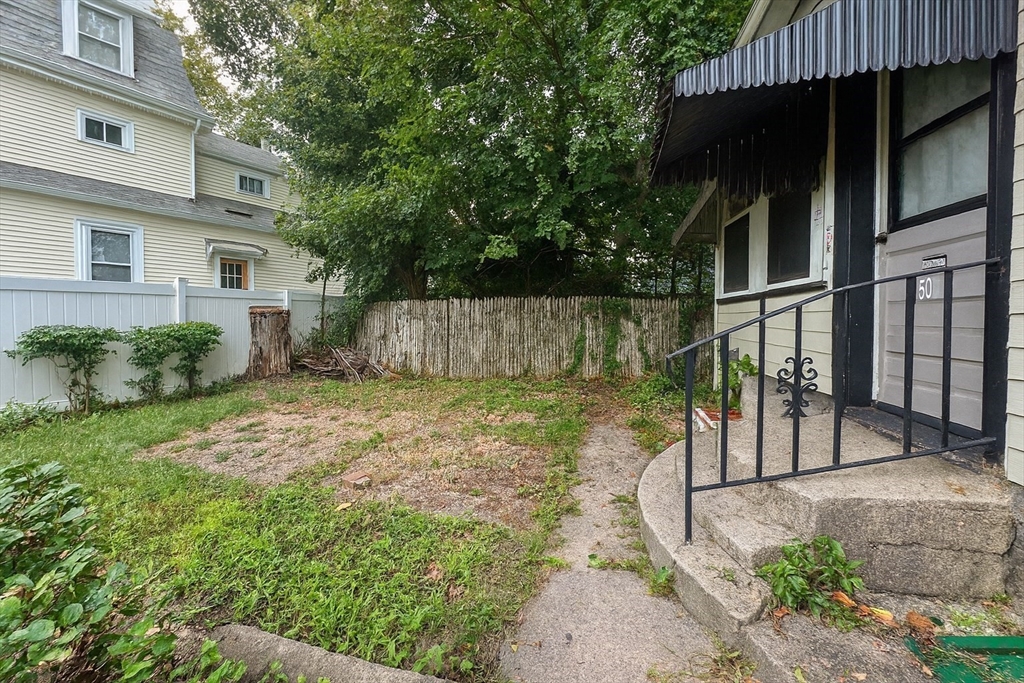 74 Davison Street Boston, MA 02136 - Photo 18 of 20 a backyard of a house with lots of green space