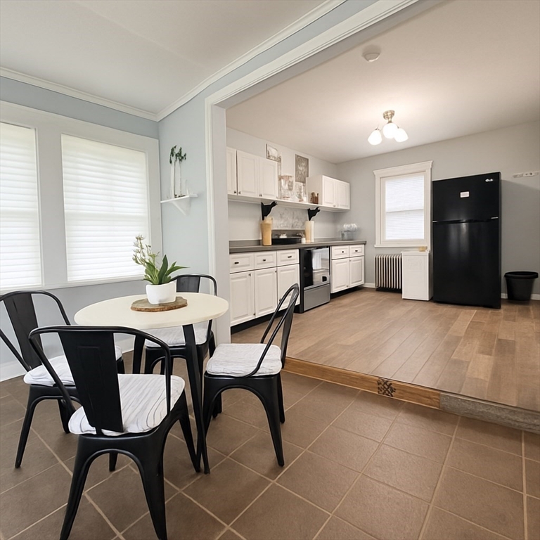 74 Davison Street Boston, MA 02136 - Photo 3 of 20 a view of a dining room with furniture and window