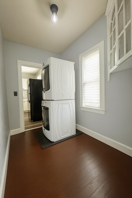 74 Davison Street Boston, MA 02136 - Photo 10 of 20 an empty room with wooden floor and windows