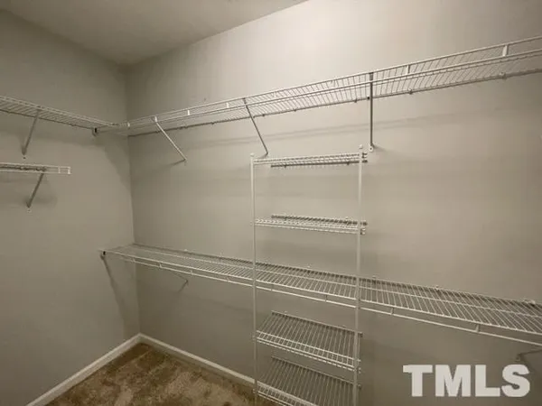 a view of a room with racks on the wall