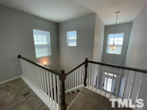 a view of staircase with rug floor