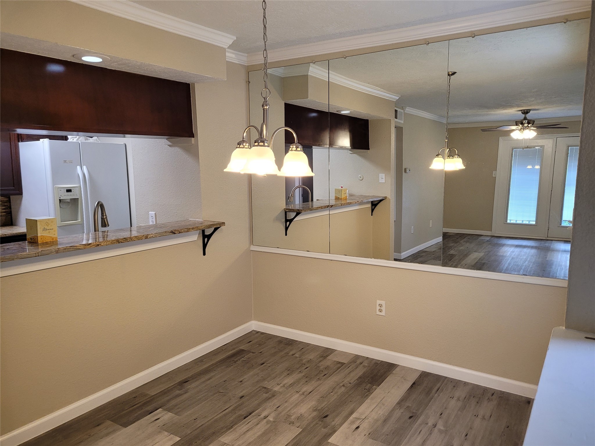 1516 Bay Area Boulevard, Unit S2 Houston, TX 77058 - Photo 4 of 11 a view of a kitchen with a sink and wooden floor
