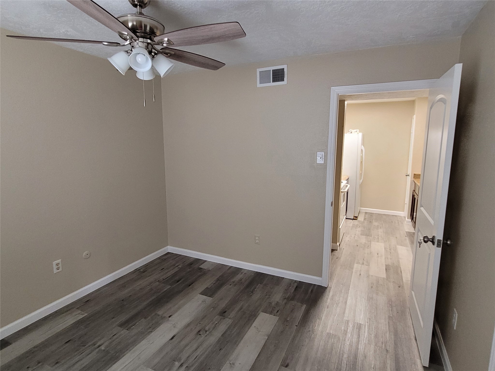1516 Bay Area Boulevard, Unit S2 Houston, TX 77058 - Photo 7 of 11 wooden floor in an empty room with a window