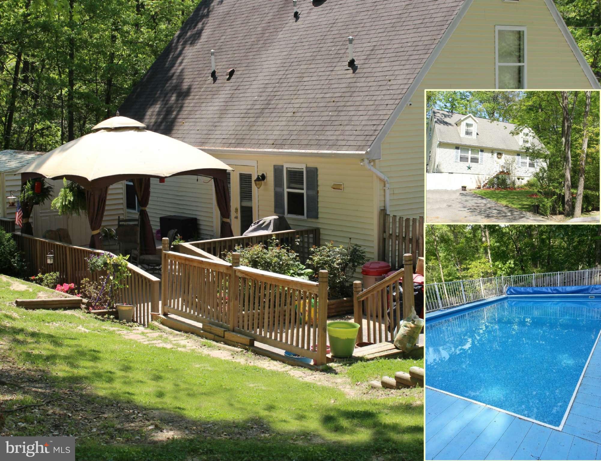 330 Red Cloud Road Lusby, MD 20657 - Photo 1 of 30 a view of a house with backyard and sitting area